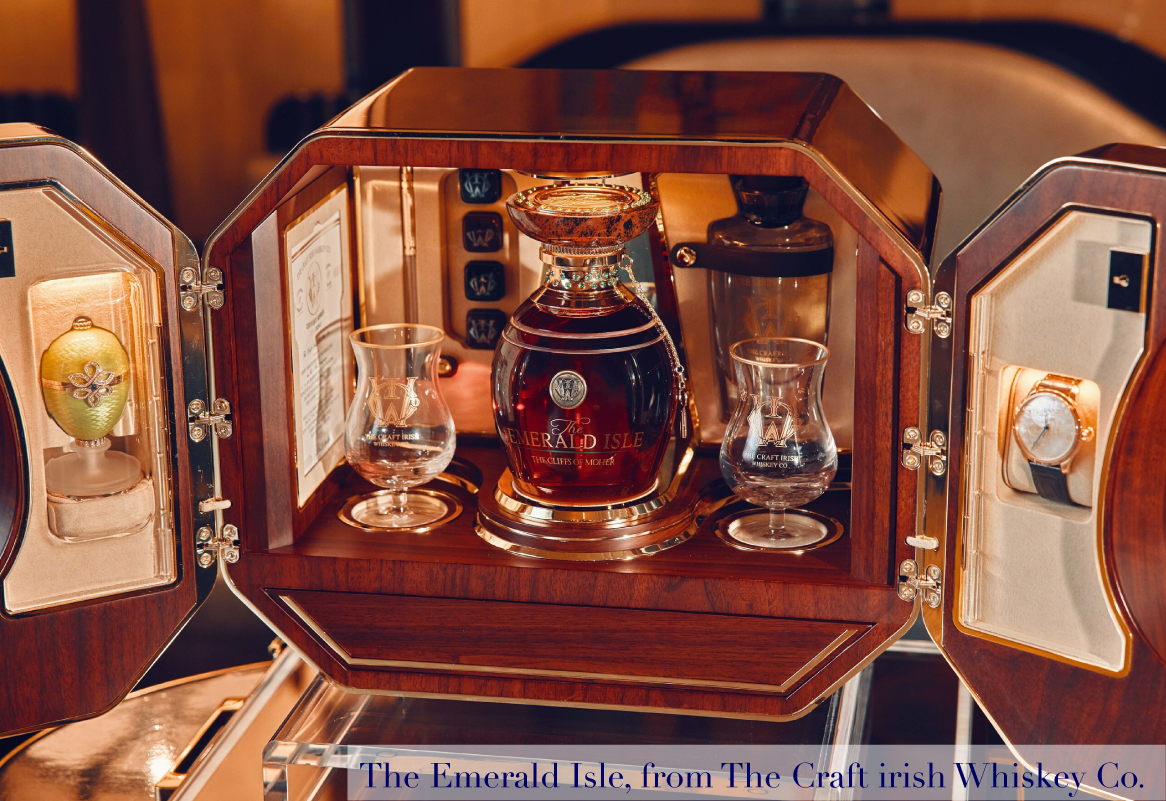 a fancy bottle of whisky in wooden case that opens , with a watch to the right