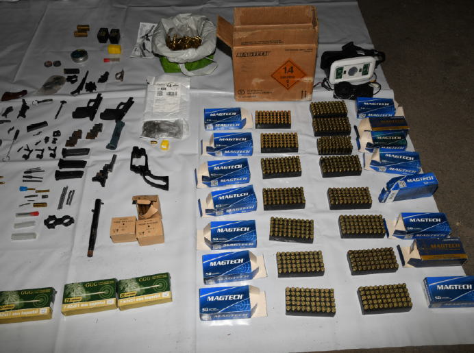 Weapon parts and bullets found. 